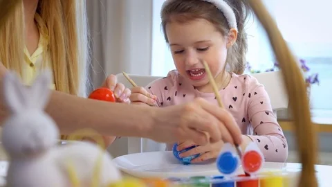 Happy Easter! Mother and her daughter with Bunny coloring Easter eggs Stock Footage 84845775
