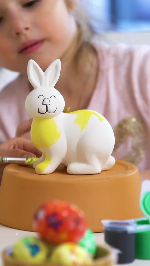 Happy Easter Mother and her little daughter with Bunny ears painting Easter Stock Footage 265185762