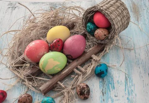 Happy Easter multi-colored eggs on wooden bacground Stock Photos