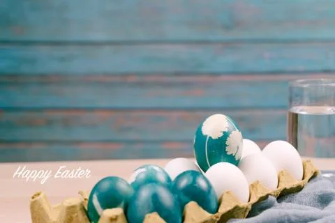 Happy easter, organic blue easter egg standing on the white color eggs wait f Stock Photos