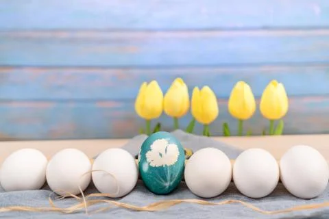 Happy easter, organic blue easter egg in middle of white color eggs wait for  Stock Photos