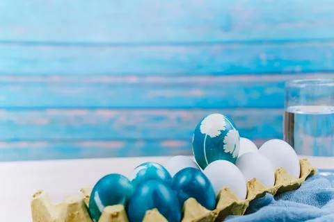 Happy easter, organic blue easter egg standing on the white color eggs wait f Stock Photos