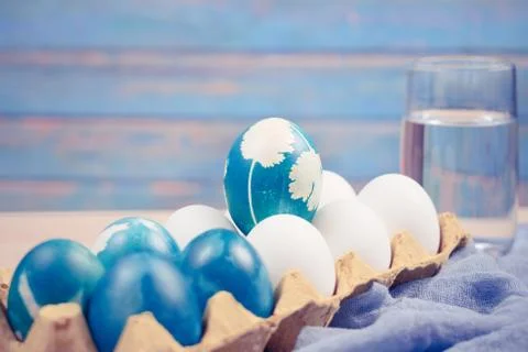Happy easter, organic blue easter egg standing on the white color eggs wait f Stock Photos