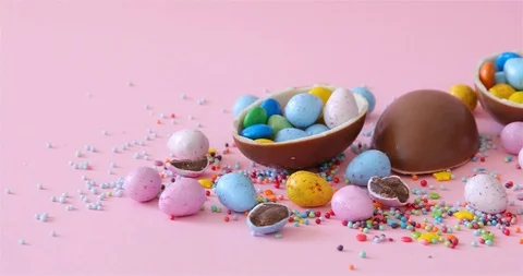 Happy Easter overhead with Easter eggs and decorations on a Pink Background Stock Footage 126608367