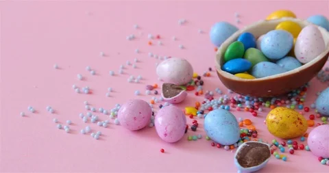 Happy Easter overhead with Easter eggs and decorations on a Pink Background Stock Footage 126608457