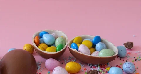 Happy Easter overhead with Easter eggs and decorations on a Pink Background Stock Footage 126608493