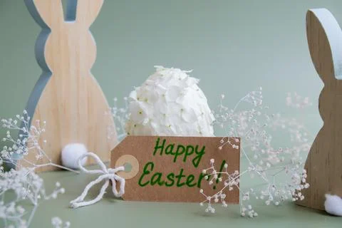 HAPPY EASTER paper note Wooden minimalism low-key bunny decor. Easter egg made Stock Photos