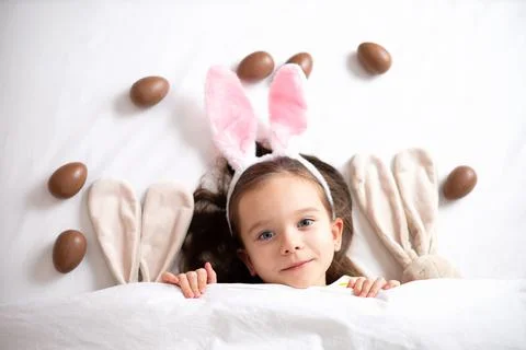 Happy Easter. Portrait of a cute beautiful girl with blue eyes and rabbit ears Stock Photos