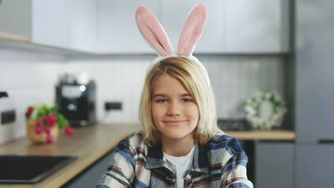 Happy easter. Portrait of the cute little blonde boy wearing bunny ears headband Stock Footage 231728154