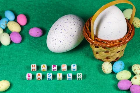 Happy Easter Speckled Candy Eggs With Weave Basket Stock Photos