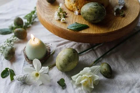 Happy Easter! Stylish dyed eggs, easter cake on wooden stand, spring flower.. Stock Photos