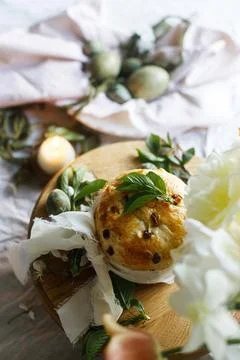 Happy Easter! Stylish eggs on napkin on plate, easter cake on stand, spring.. Stockfoto's