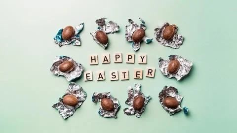 Happy easter text and chocolate eggs stop motion, stock video footage 4k Stock Footage 266810376