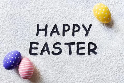 Happy Easter text and rolling pin, whisk for whipping, cookie cutters, quail  Stock Photos