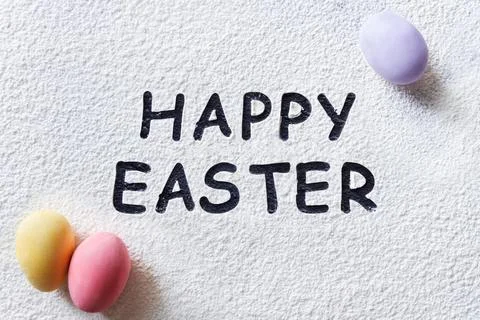 Happy Easter text and rolling pin, whisk for whipping, cookie cutters, quail  Stock Photos