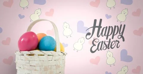 Happy Easter text with Easter eggs in basket in front of pattern Stock Photos