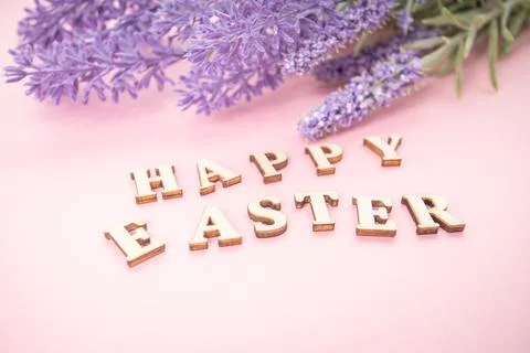 Happy Easter text on rose background. Stock Photos