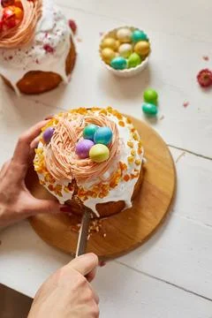 Happy Easter, Woman cut Easter cake for the holiday Stock Photos