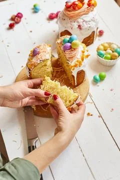 Happy Easter, Woman cut Easter cake for the holiday Stock Photos