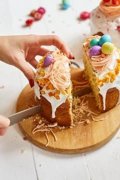 Happy Easter, Woman cut Easter cake for the holiday Stock Photos