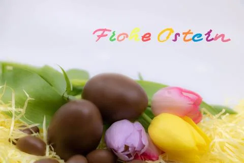 Happy Easter written in German very colorful to celebrate Easter Stock Photos