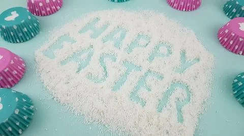 Happy Easter is written on a light blue background. according to Pantone, cup Stock Photos