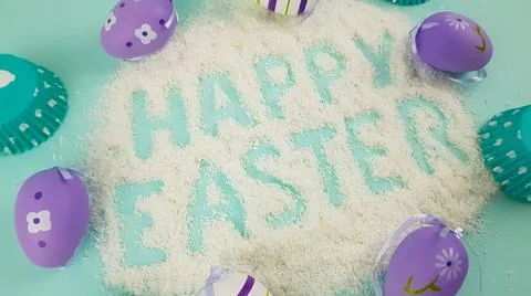 Happy Easter is written on a light blue background. according to Pantone, cup Stock Photos