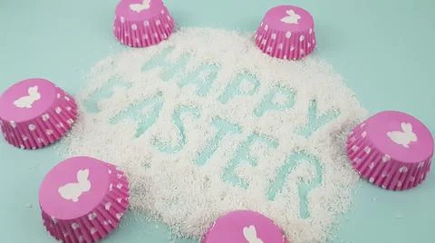 Happy Easter is written on a light blue background. according to Pantone, cup Stock Photos