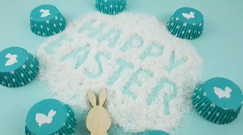 Happy Easter is written on a light blue background. according to Pantone, cup Stock Photos