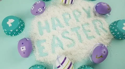 Happy Easter is written on a light blue background. according to Pantone, cup Stock Photos