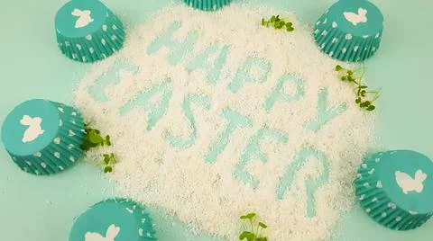 Happy Easter is written on a light blue background. according to Pantone, cup Stock Photos