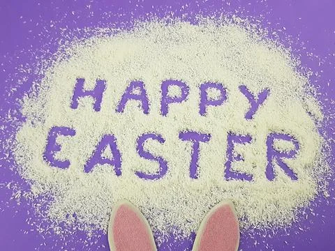 Happy Easter is written on a purple background according to Pantone trending  Stock Photos