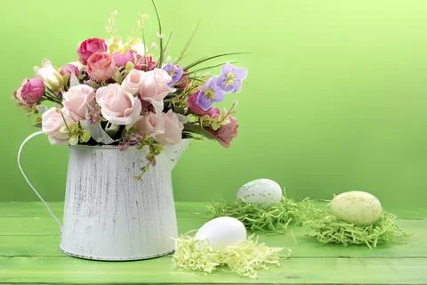 Happy Easter.Bouquet of flowers and Easter eggs.Place for text. Stock Photos