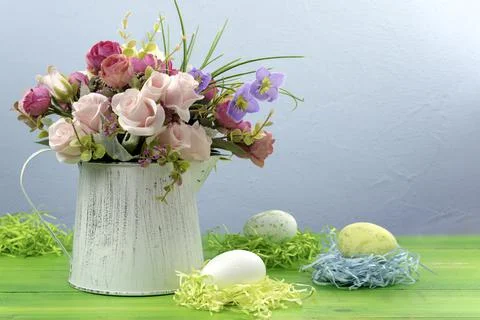 Happy Easter.Bouquet of flowers and Easter eggs.Place for text. Stock Photos
