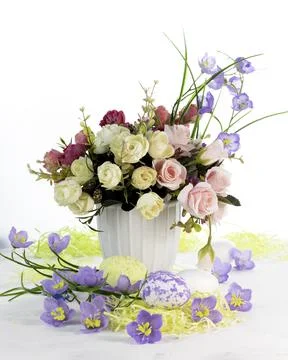Happy Easter.Bouquet of flowers and Easter eggs.Place for text. Stock Photos