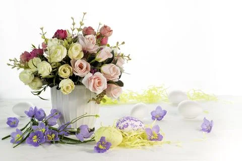 Happy Easter.Bouquet of flowers and Easter eggs.Place for text. Stock Photos