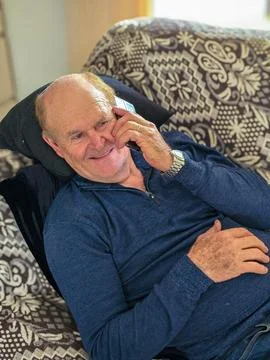Happy elderly man on cell phone Stock Photos