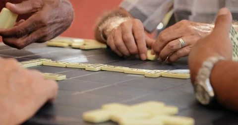 Happy Elderly Man Smiling And Playing Domino With Friends Stock Footage 76964799