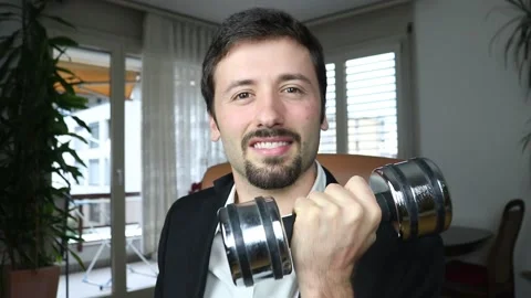 Happy elegant man lifting weights Video stock 163093058