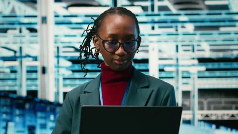 Happy employee in data center using laptop and digital twin virtualization Stock Footage 329592896