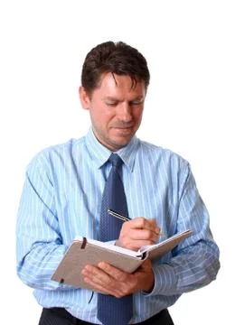 Happy employee writes notes in notebook Stock Photos