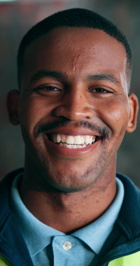 Happy, engineer and face of man on construction site for about us, renovation Stock Footage 340964867