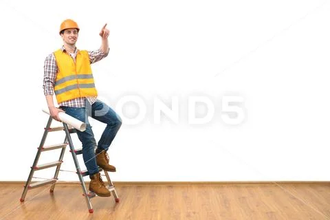 The happy engineer on the ladder gesturing on the white wall background Stock Photos
