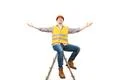 The happy engineer on the ladder gesturing on the white background Photo