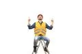 The happy engineer sitting on the ladder on the white background Photo