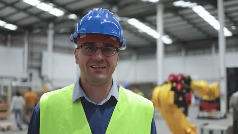 Happy engineer working inside robotic facility - New industrial tech concept Stock Footage 212682880