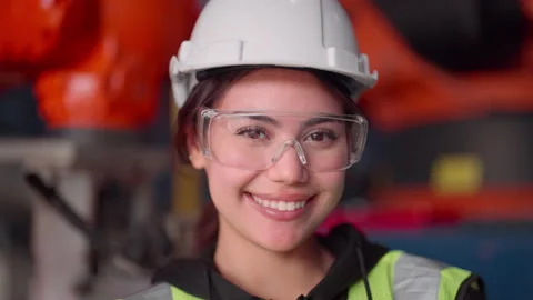 Happy Engineers Smiling for Camera Amid Cutting-Edge Robot Production Line. Stock Footage 239454828