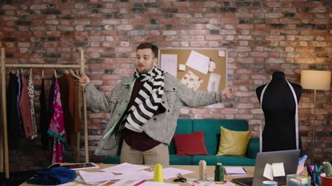 Happy excited designer guy dancing at his office while working over his new Stock Footage 194301247