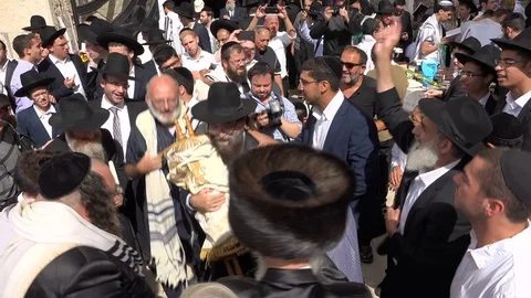 Happy excited Orthodox Jews dance around Torah in Jerusalem, Israel Stock Footage