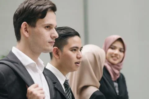 Happy expression face group of young executive people in formalwear standing  Fotos Stock